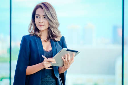 Young businessman thinking and planning on a bright day .の写真素材