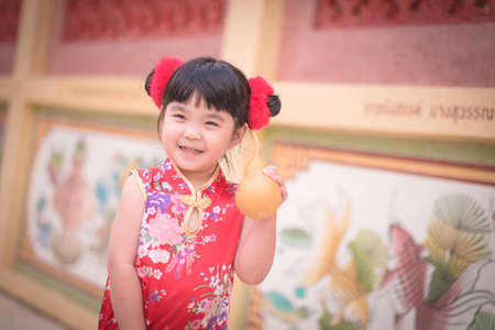Asian Chinese girl in Traditional Chinese hold calabash,Photos provided by background ambience China .の写真素材