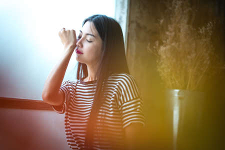 The little girl is smelling the perfume on your wrist.の写真素材