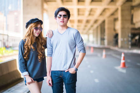 Couple standing pose . And sunglasses , Background road under the highway .の写真素材