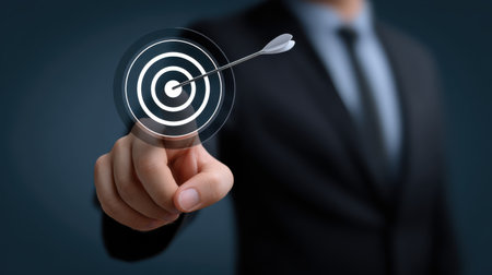 A businessman using digital tools to visualize and target his professional goals effectively.の素材
