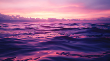 A peaceful scene capturing serene ocean waves reflecting a stunning sunset.の素材