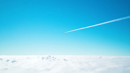 A jet soars high above fluffy clouds showcasing the beauty of flight and nature.の素材