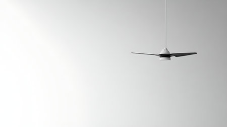 A sleek and modern ceiling fan showcases minimalist design in a clean contemporary space.の素材