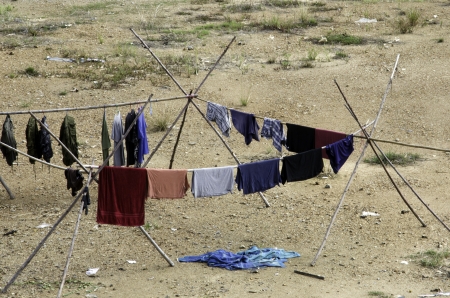 Clothes drying on a wooden rack.の写真素材