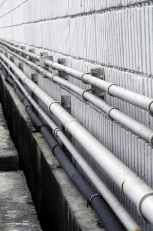 Oil pipeline that is stuck on the wall.の写真素材