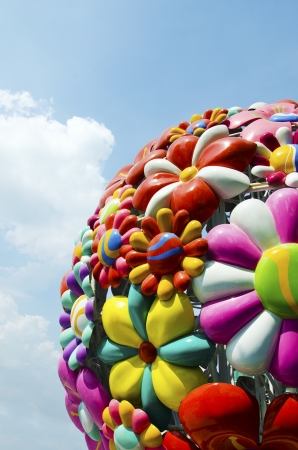 Sculptures of flowers with the sky as a backdrop の写真素材
