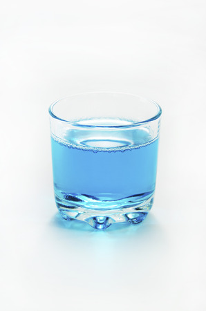 Side of a glass of water with white background  の写真素材