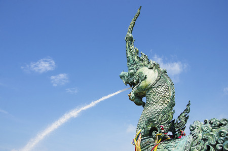 Were spraying water dragon statue in the sky as a backdrop.の写真素材