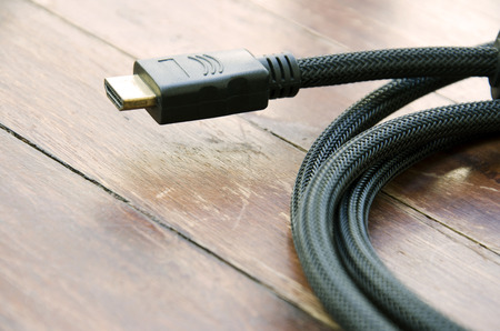 Hdmi cable to the wood floor as a backdrop.
