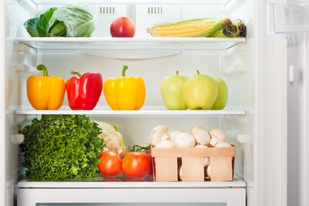 Open refrigerator full of fruits and vegetables. Weight loss diet concept.の写真素材