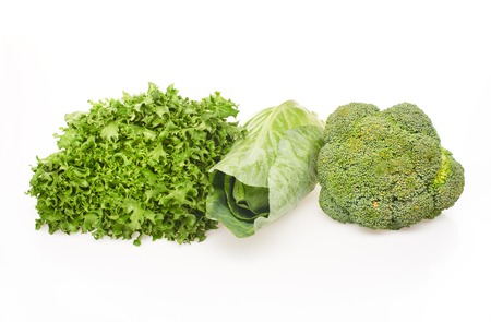 Green salad, green cabbage and green broccoli isolated on white backgroundの写真素材