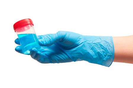 Close up of female doctor's hand in blue sterilized surgical glove holding transparent plastic...