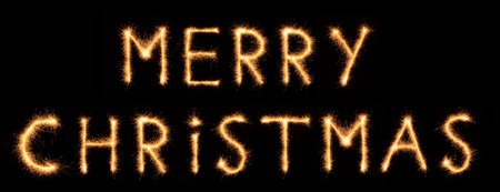 "MERRY CHRISTMAS" lettering drawn with bengali sparkles isolated on black backgroundの写真素材