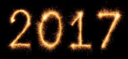 "2017" number drawn with bengali sparkles isolated on black backgroundの写真素材