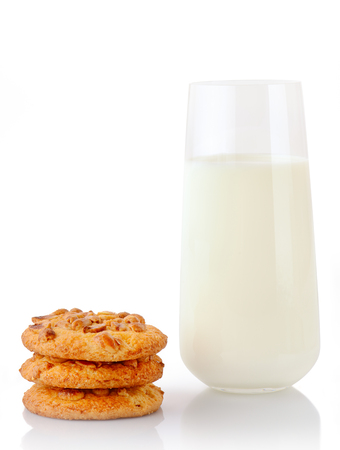 Stack of three homemade peanut butter cookies and glass of milk, isolated on white backgroundの写真素材