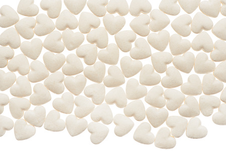 White heart shape tablets isolated on white backgroundの写真素材