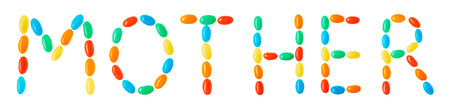 "mother" lettering made of multicolored candies isolated on white backgroundの写真素材