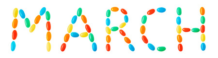 "march" lettering made of multicolored candies isolated on white backgroundの写真素材