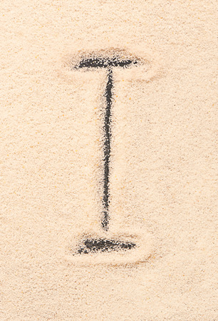 I letter written on sandの写真素材