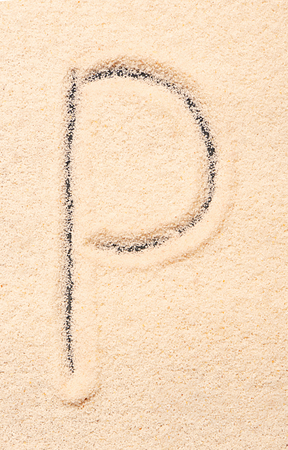 P letter written on sandの写真素材