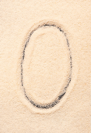 O letter written on sandの写真素材