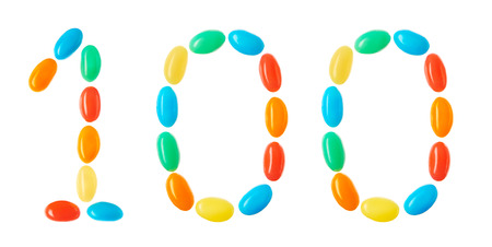 100 number made of multicolored candies isolated on white backgroundの写真素材