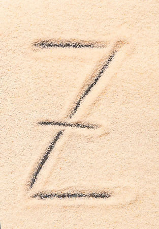 Z letter written on sandの写真素材