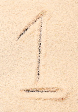 1 number written on sand. Summer beach backgroundの写真素材