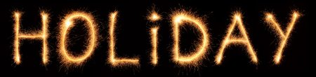 Holiday lettering drawn with bengali sparkles isolated on black backgroundの写真素材