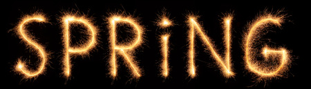 Spring lettering drawn with bengali sparkles isolated on black backgroundの写真素材