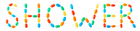 Shower lettering made of multicolored candies isolated on white backgroundの写真素材