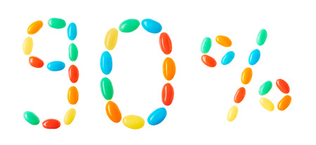 90% lettering made of multicolored candies isolated on white backgroundの写真素材