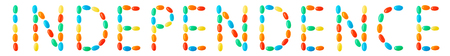 Independence lettering made of multicolored candies isolated on white backgroundの写真素材