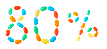 80% lettering made of multicolored candies isolated on white backgroundの写真素材