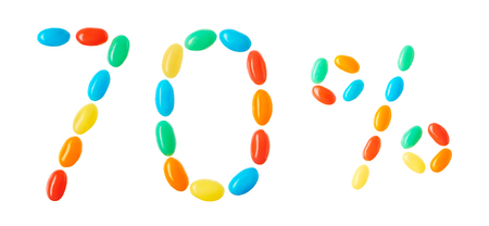 70% lettering made of multicolored candies isolated on white backgroundの写真素材