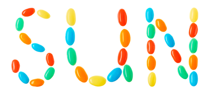 Sun lettering made of multicolored candies isolated on white backgroundの写真素材