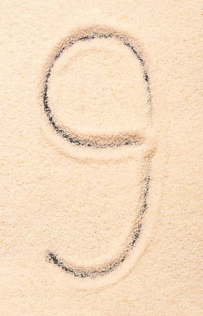 9 number written on sand. Summer beach backgroundの写真素材