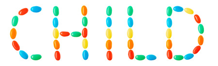 Child lettering made of multicolored candies isolated on white backgroundの写真素材