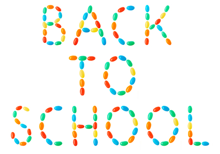 Back to school lettering made of multicolored candies isolated on white backgroundの写真素材