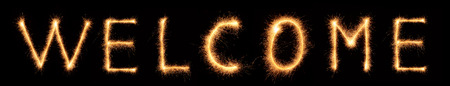 Welcome lettering drawn with bengali sparkles isolated on black backgroundの写真素材