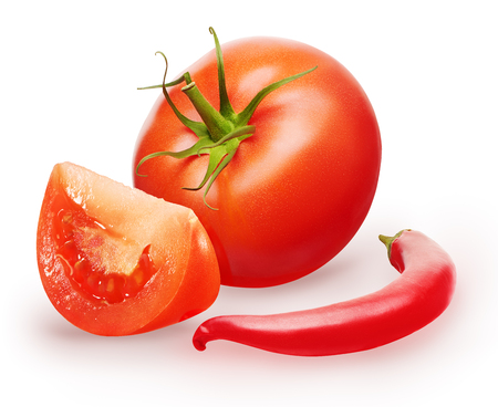 Whole fresh red tomato with green leaf, slice and chili pepper isolated on white backgroundの写真素材