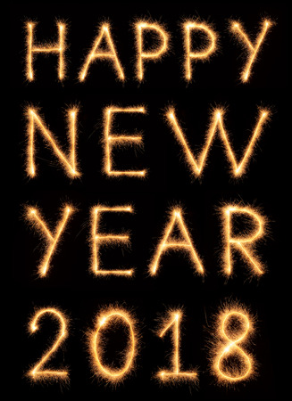 HAPPY NEW YEAR 2018 lettering drawn with bengali sparkles isolated on black backgroundの写真素材