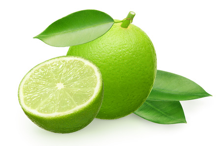 Whole fresh lime fruit with half and green leaves isolated on white backgroundの写真素材