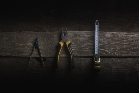 three tools on a wooden background