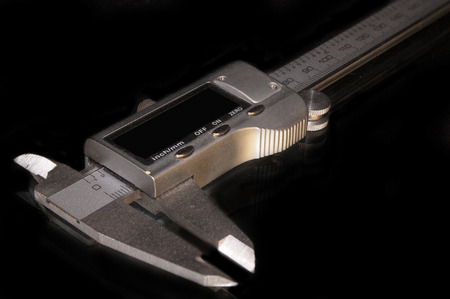 Electronic calipers. Measuring device on a dark backgroundの写真素材