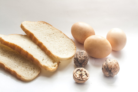 Bread seasoning and eggs on the sunny kitchenの写真素材