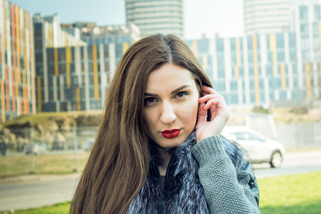 Street photoshoot of a girl in the city. Direction and style street fashion.の写真素材