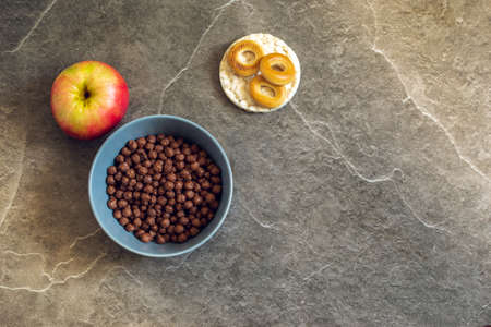 Still life of healthy food products. Colored dishes with food on the background of a stone...