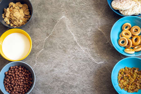 Still life of healthy food products. Colored dishes with food on the background of a stone countertopの写真素材